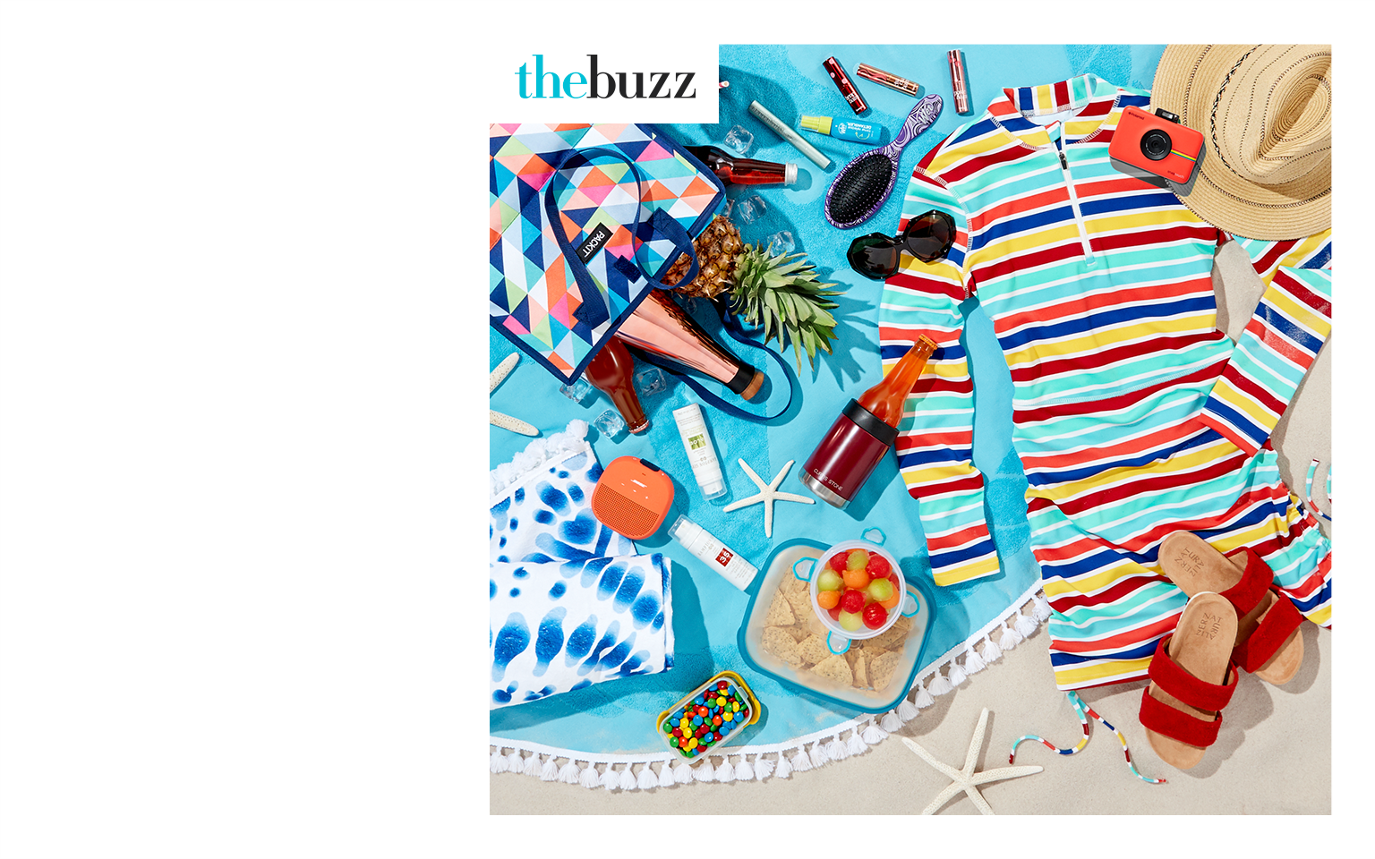 The June 2018 Edition of the Style Edit. An image of beach day essentials lying on a blanket in the sand.