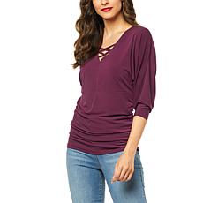 IMAN
Global Chic Criss-Cross Neckline Top